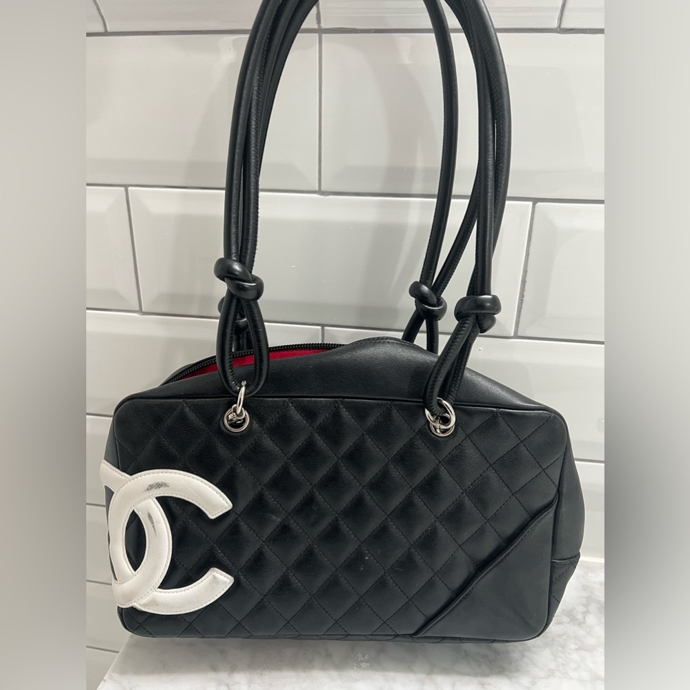 CHANEL
Calfskin Quilted Cambon Bowler bag in black
